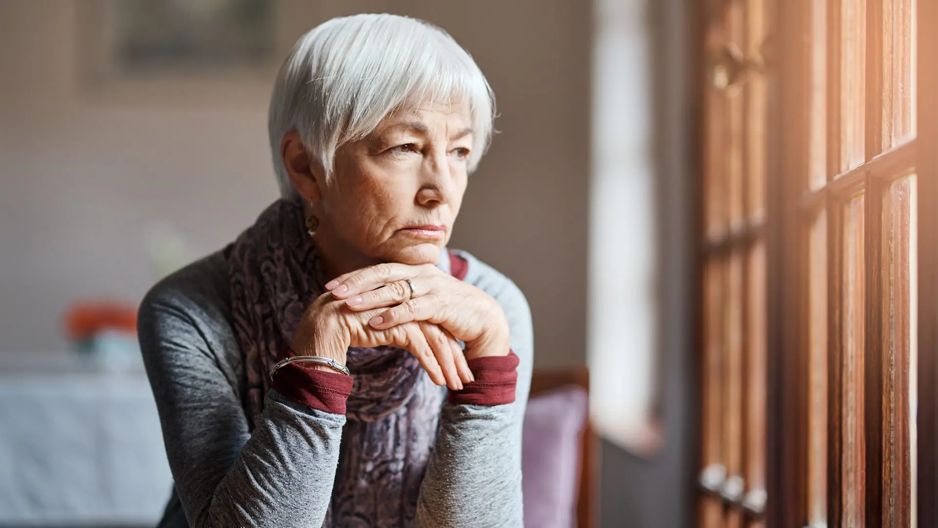 Shot of a senior woman looking thoughtful in a retirement home