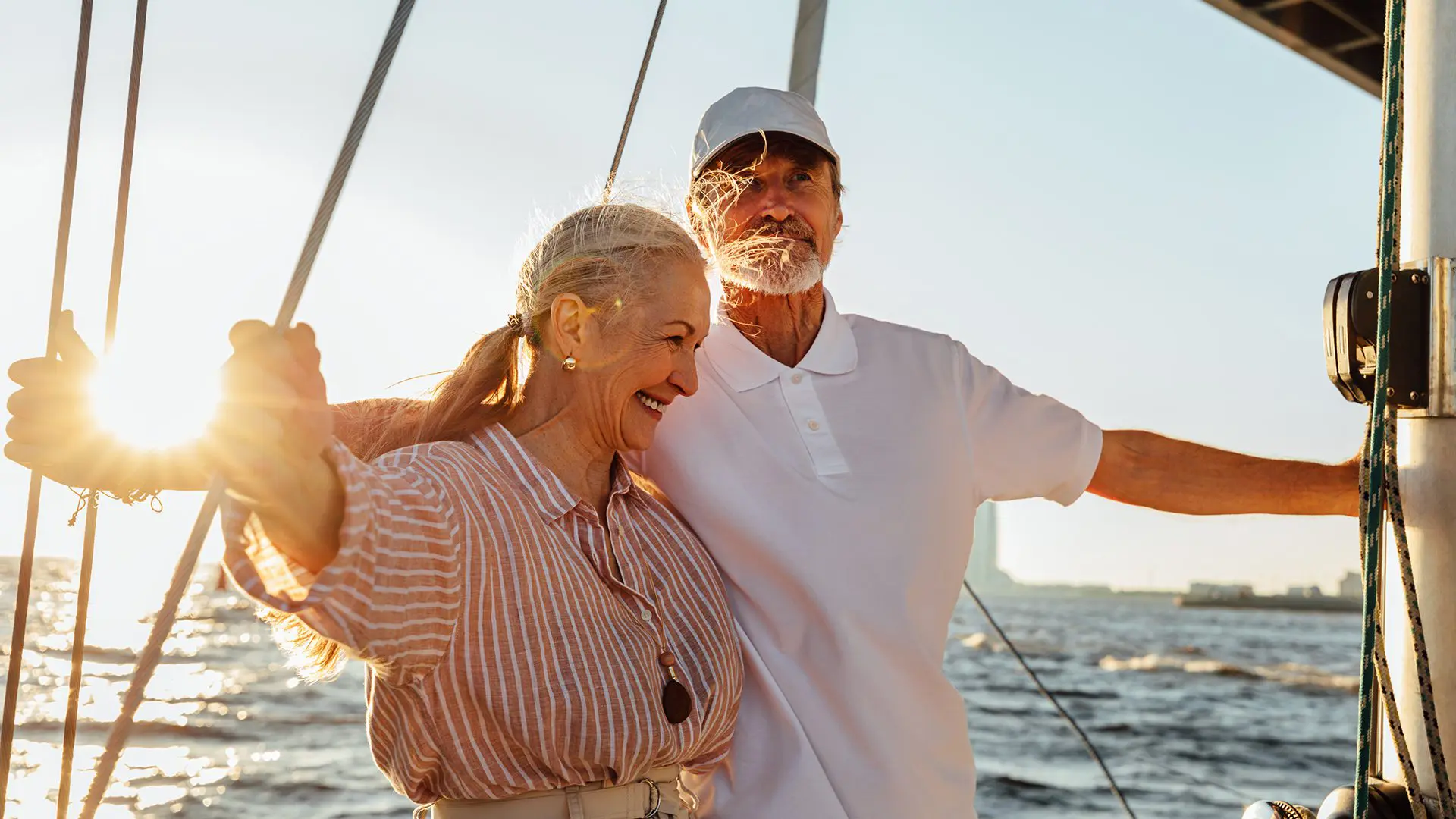 senior couple on a boat in the sunset