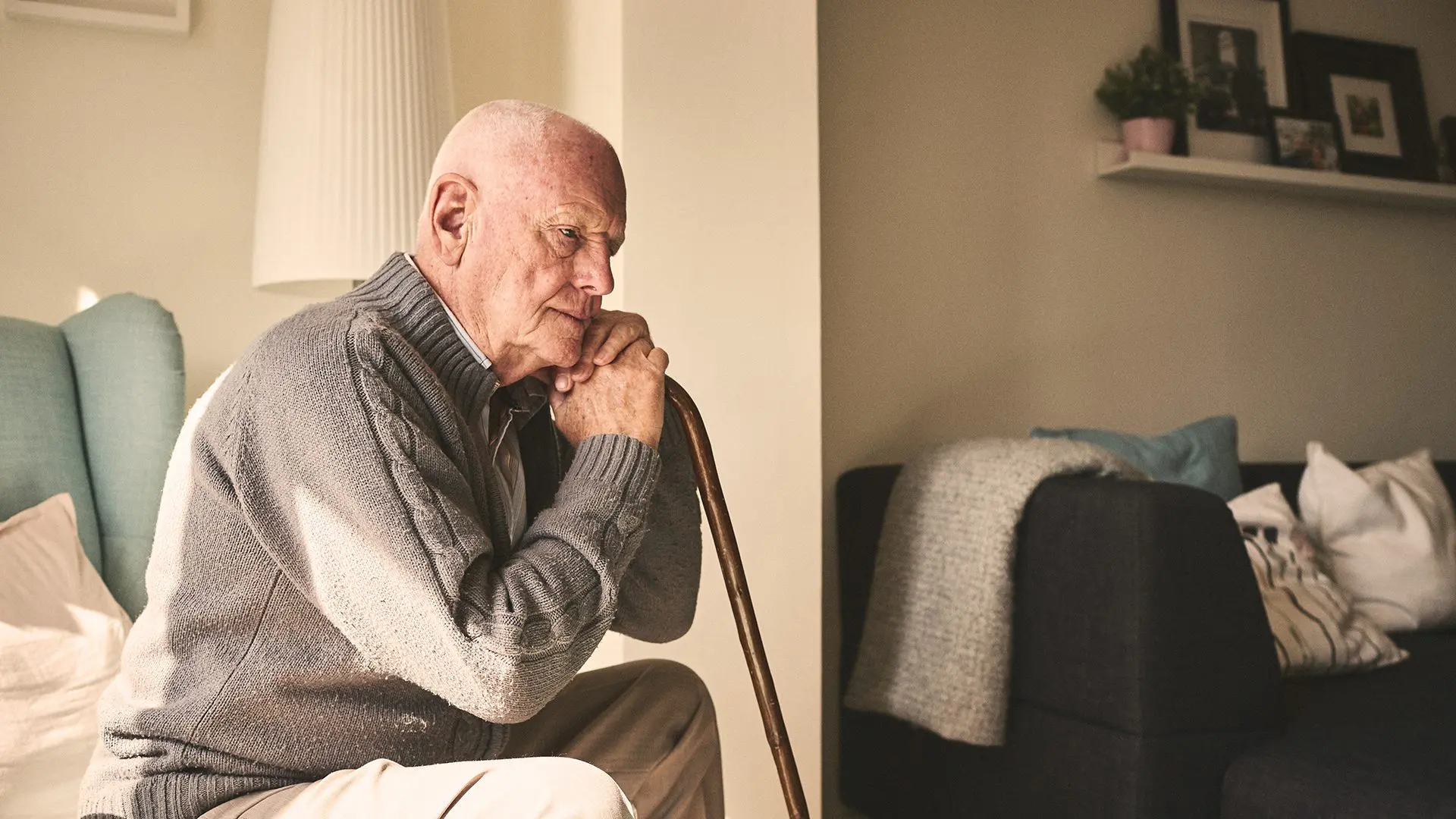senior man experiencing sundowners syndrome alone at home