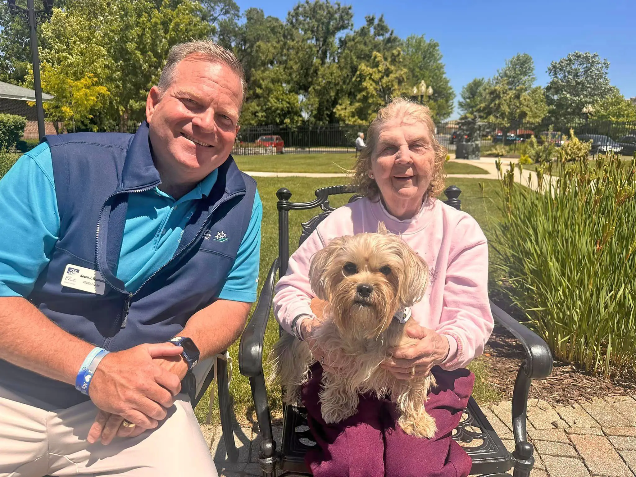 Kevin Benema with a resident of The Cottages of New Lenox and her dog