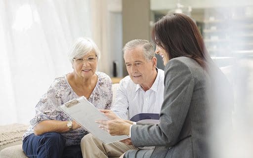 assisted living sales team member in a meeting with seniors