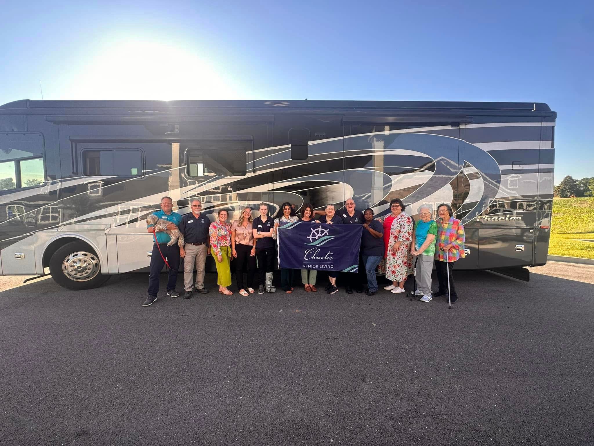 Charter Senior Living Co-Founders next to their RV